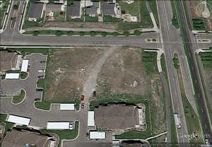 Aerial overview of property's location featuring nearby suburban area