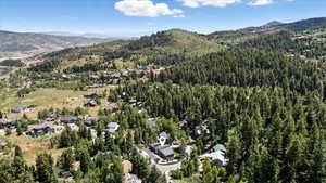 Aerial view of property's location with a mountain backdrop