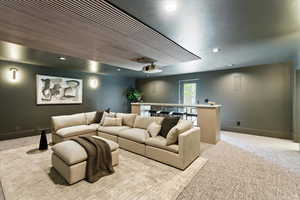 Cinema room with recessed lighting and carpet floors