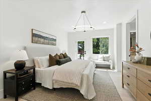 Bedroom with access to outside and recessed lighting
