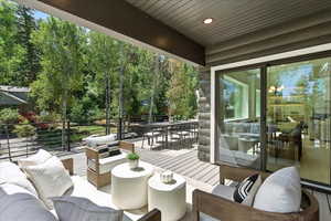Wooden deck featuring outdoor lounge area and outdoor dining area