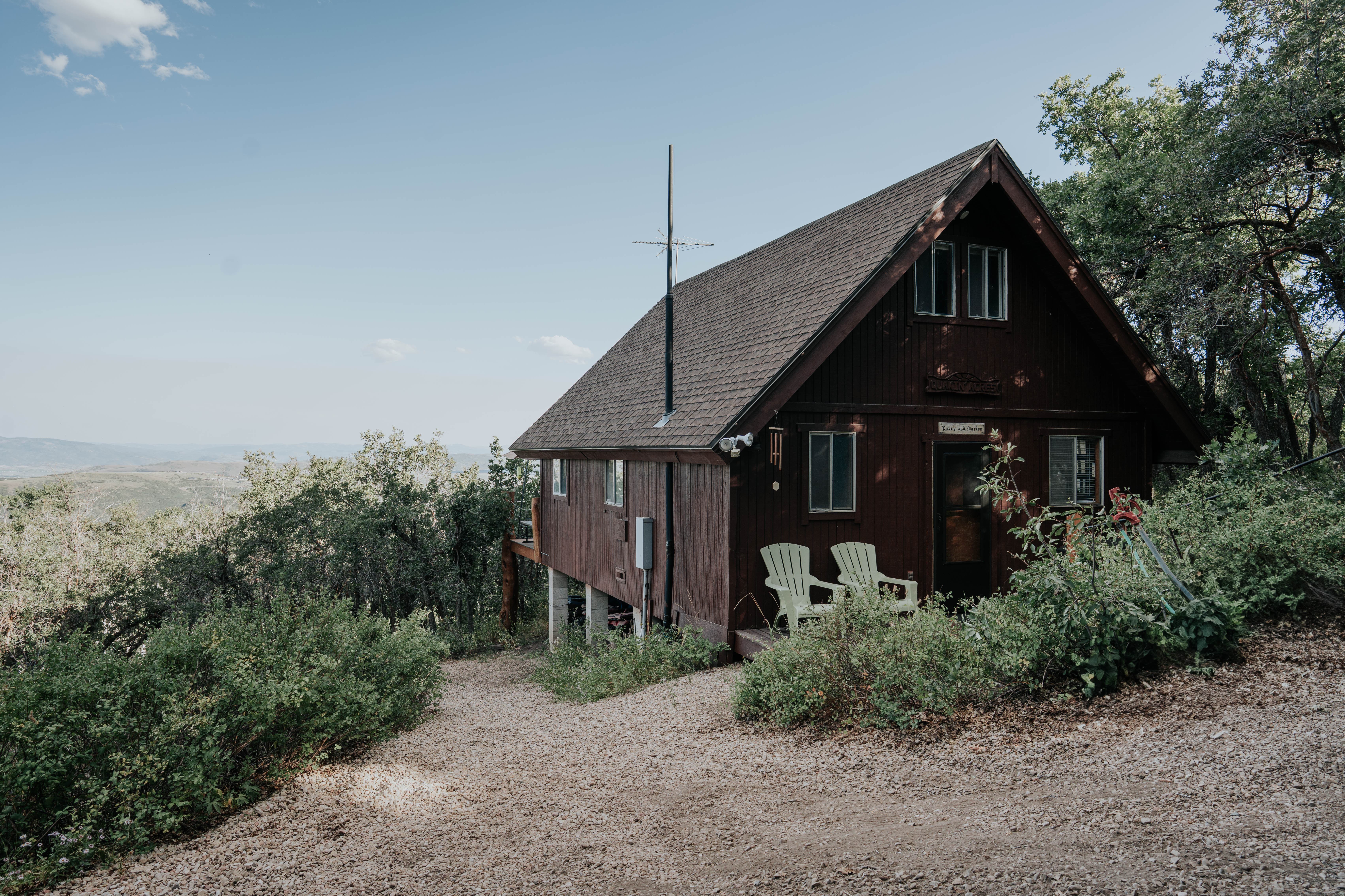 Front of house featuring a shingled roof