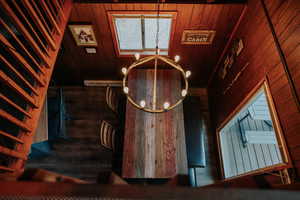Stairs featuring wood walls