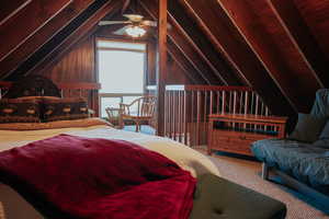 Carpeted bedroom featuring vaulted ceiling