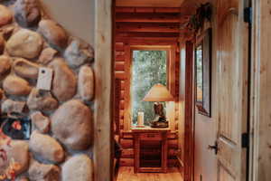 Hall featuring light wood finished floors