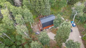View from above of property with a heavily wooded area
