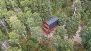 View of subject property with a heavily wooded area