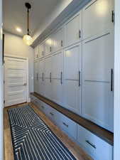 Mudroom featuring recessed lighting and wood finished floors