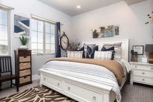 Bedroom with carpet flooring, baseboards, and recessed lighting