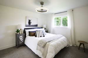 Bedroom with carpet floors and baseboards