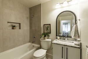 Bathroom with vanity and washtub / shower combination