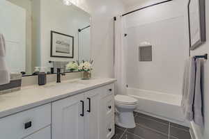 Full bathroom featuring vanity, shower / tub combo, and tile patterned floors