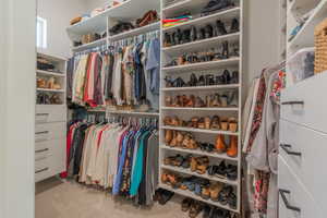Spacious closet featuring carpet floors
