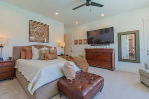 Bedroom with light carpet, recessed lighting, and ceiling fan