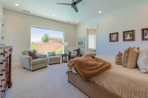 Carpeted bedroom with recessed lighting and a ceiling fan