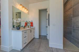 Full bathroom with vanity and walk in shower