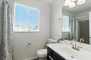 Bathroom with vanity and a shower with shower curtain