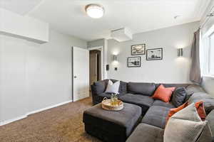 Living room with carpet floors and baseboards