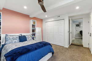 Bedroom with carpet flooring, beamed ceiling, recessed lighting, a closet, and a ceiling fan