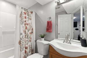 Full bath with vanity and shower / bath combo