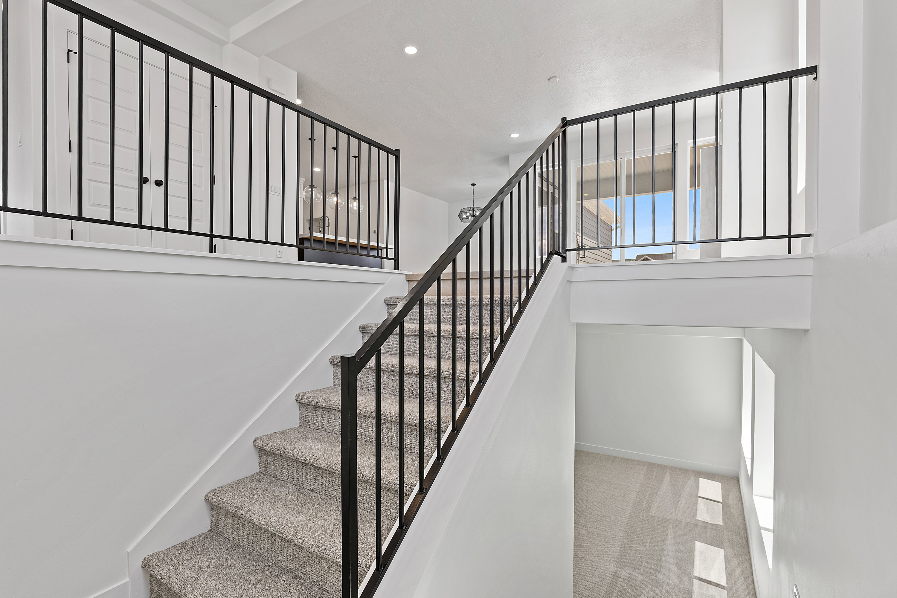 Stairs featuring carpet floors and recessed lighting