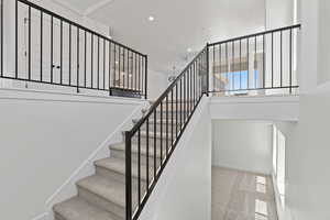 Stairs featuring carpet floors and recessed lighting
