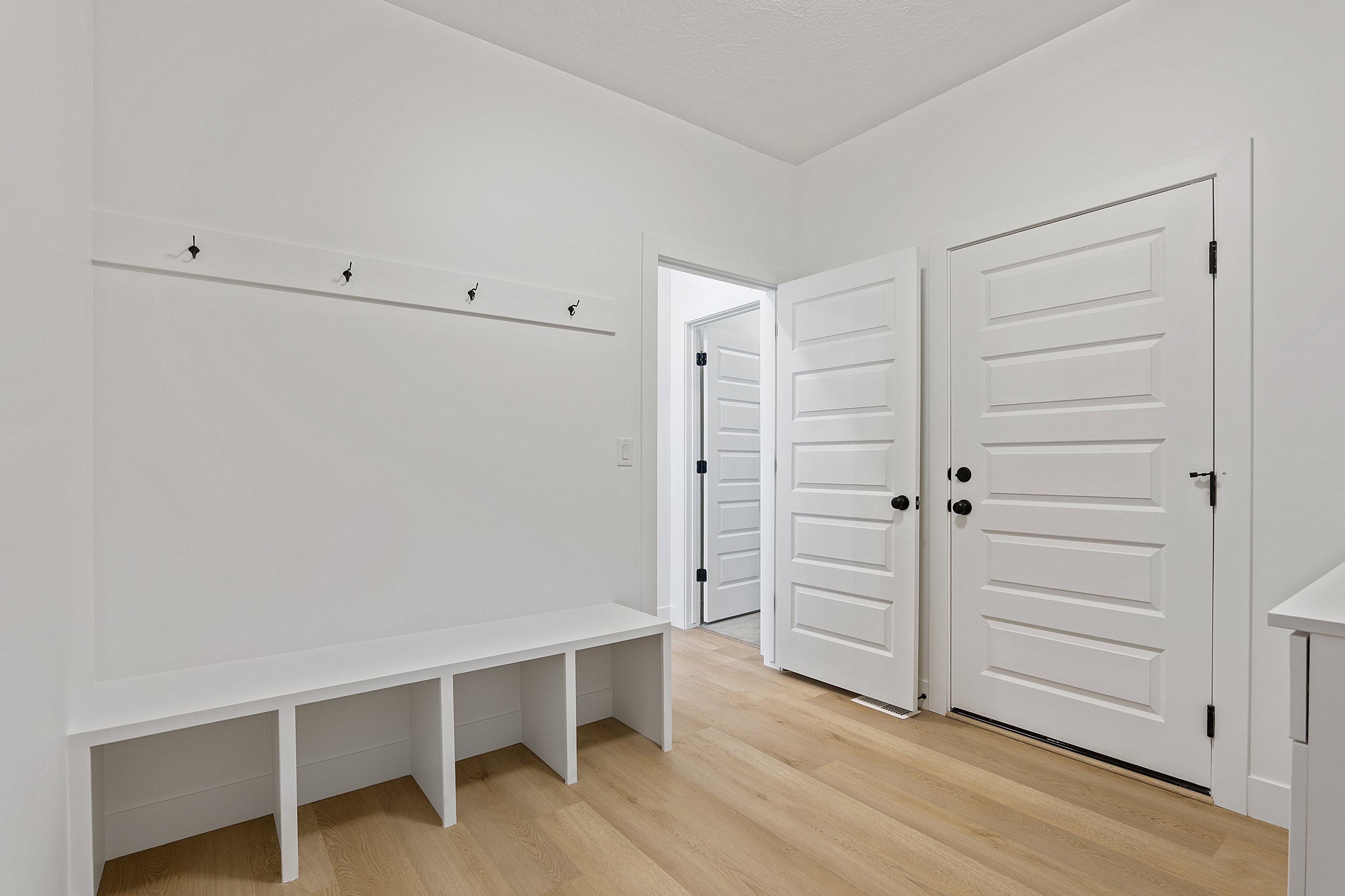 Mudroom with light wood-style floors
