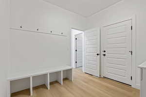 Mudroom with light wood-style floors
