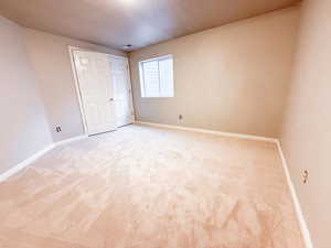 Unfurnished bedroom with carpet floors and a closet