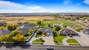 Aerial perspective of suburban area featuring a mountain backdrop