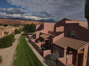 Aerial perspective of suburban area featuring a mountain backdrop