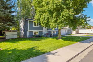 View of front of property featuring driveway and an attached garage