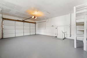 Garage featuring a garage door opener