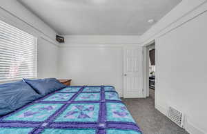 Bedroom with carpet floors and baseboards