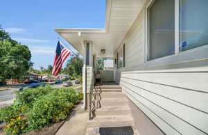 Entrance to property with a porch