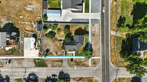 Aerial view of property and surrounding area featuring property parcel outlined. *Property boundaries are estimated and do not reflect a legal survey.