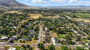 Aerial overview of property's location featuring nearby area and a mountains.