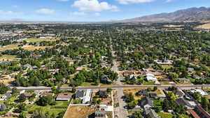 View of property location featuring nearby suburban area and a mountain background.
