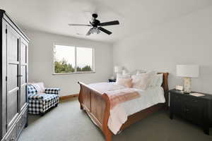 Bedroom featuring light colored carpet and ceiling fan