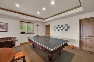 Playroom with crown molding, carpet, recessed lighting, and a raised ceiling