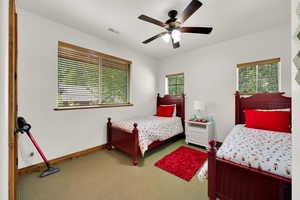 Bedroom featuring carpet floors and ceiling fan