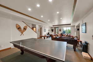 Game room featuring recessed lighting, a tray ceiling, carpet, and crown molding