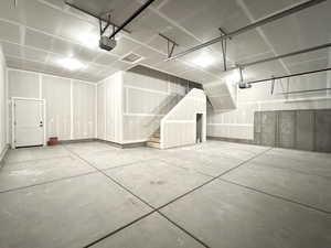Garage featuring a garage door opener