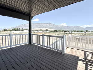 Wooden deck featuring a mountain view