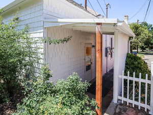 View of side of property with a chimney