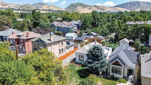 Aerial view of residential area featuring mountains