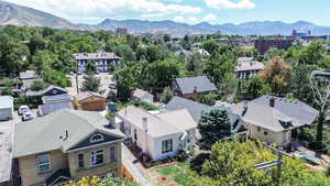 Aerial perspective of suburban area featuring a mountainous background