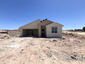 View of front of property with stucco siding