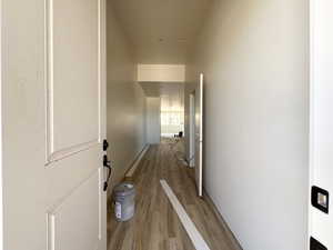 Corridor with light wood-style floors