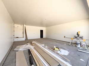 Misc room featuring concrete floors and baseboards